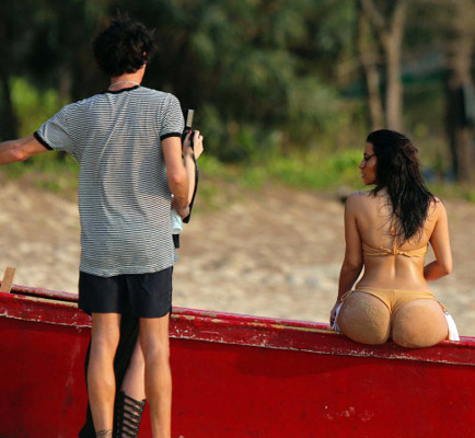 Kim Kardashian shows off her famous booty in a bikini on a photo shoot in Thailand.